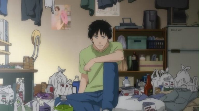 Manga Review - Der Protagonist der Manga Serie Welcome to the N.H.K. Er sitzt in seinem unordentlichem Zimmer und schaut auf den Betrachter.